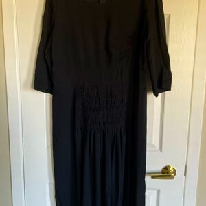Comrags black wool crepe dress.